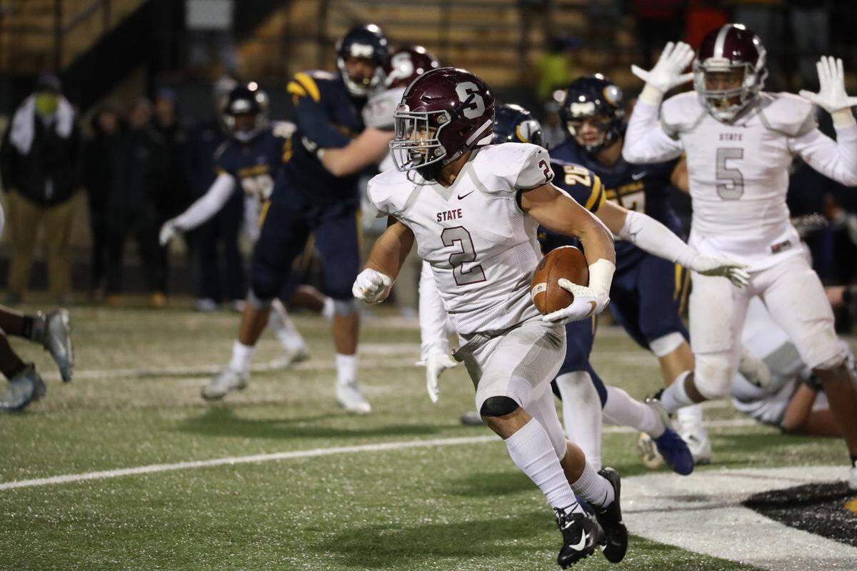 State College’s Dresyn Green runs downfield against Central Catholic on Friday in the PIAA football championships quarterfinals at North Allegheny High School. Central Catholic won 24-21. 