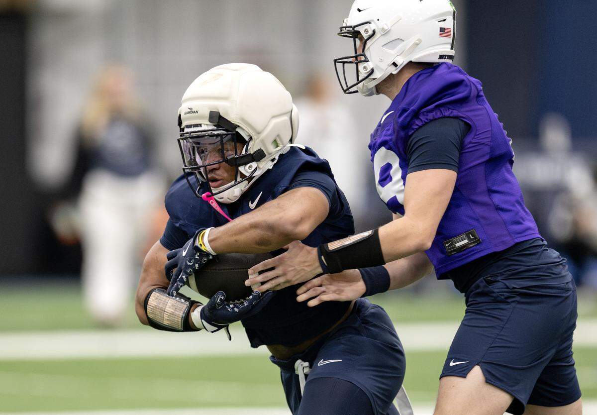 Penn State running back James Peoples gets the handoff from quarterback Jack Lambert during spring practice on Thursday, March 26, 2026.  