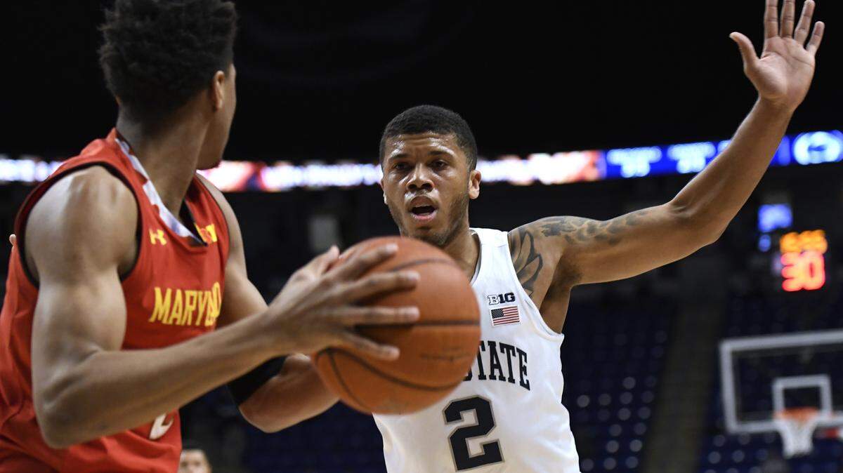 Penn State guard Myles Dread, right, defends Maryland guard Aaron Wiggins, left, during the first half of an NCAA college basketball game Wednesday, Feb. 27, 2019, in State College, Pa. (AP Photo/John Beale)