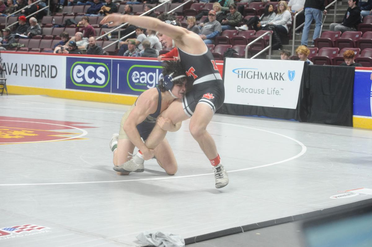 Bald Eagle Area’s Caleb Close aims to finish off a takedown of Lackawanna Trail’s Robbie Schneider in their 172-pound first round match of the PIAA Class 2A Championships on Thursday, March 9, 2023 at the Giant Center in Hershey. Close beat Schneider, 5-2.
