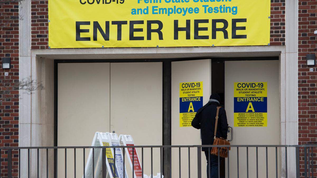 A person enters Penn State’s student and employee COVID-19 testing facility at the White Building on Tuesday.