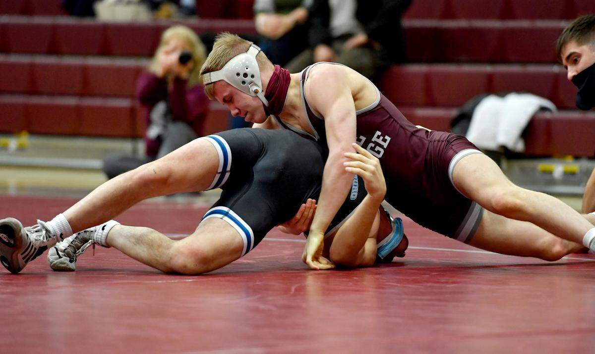 State College’s Pierson Manville controls Chambersburg’s Anthony Colangelo in the in 138 lb bout during the match on Monday, Feb. 8, 2021. Manville won by tech fall, 15-0.