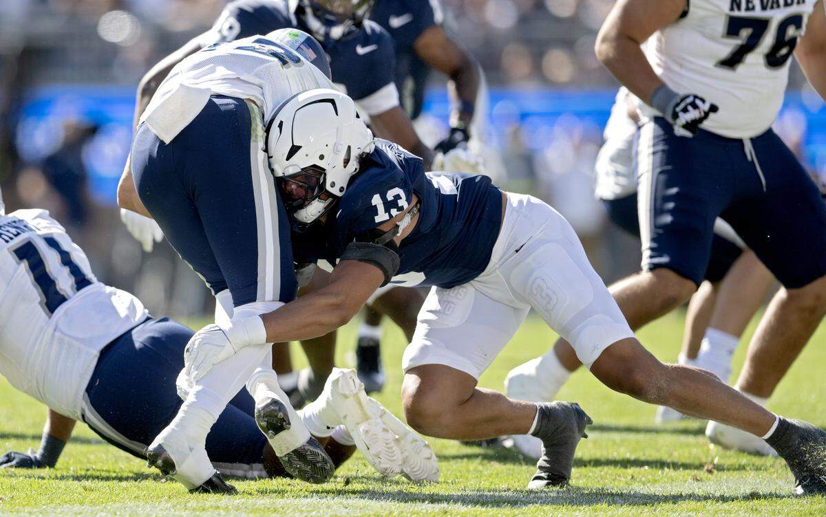 Penn State linebacker Tony Rojas stops Nevada quarterback Chubba Purdy during the game on Saturday, Aug. 30, 2025 at Beaver Stadium.