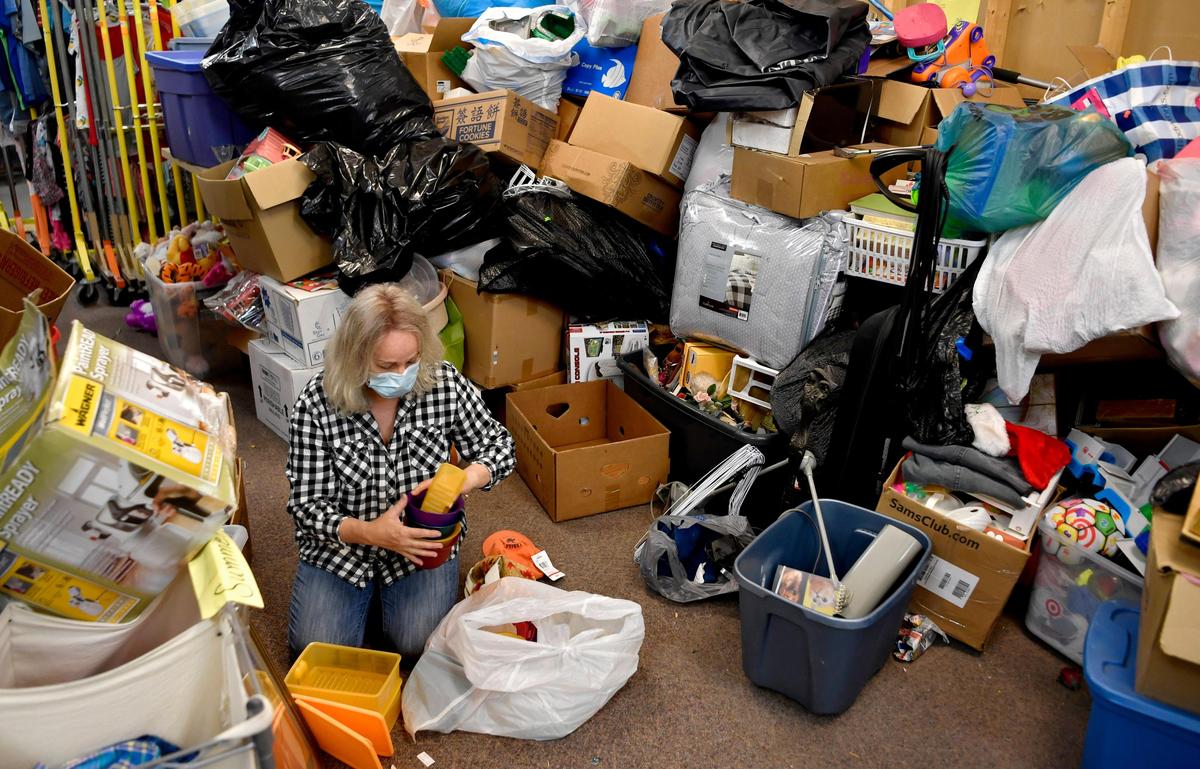 Rebecca Holter, a staff member and volunteer at the FaithCentre in Bellefonte, helps to sort through the items donated over the weekend on Monday, May 18, 2020. Donations have been high since the thrift store reopened.
