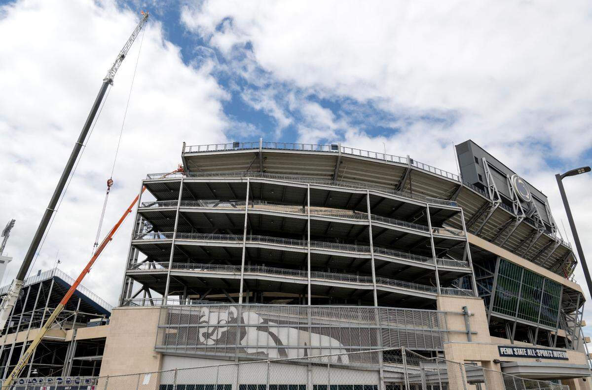 Cranes and construction workers are pictured at Penn State’s Beaver Stadium on Thursday. Last May, the board of trustees voted to move forward with a $70 million renovation that included winterizing the stadium. Up to $700 million in further renovations is expected to be discussed Tuesday.