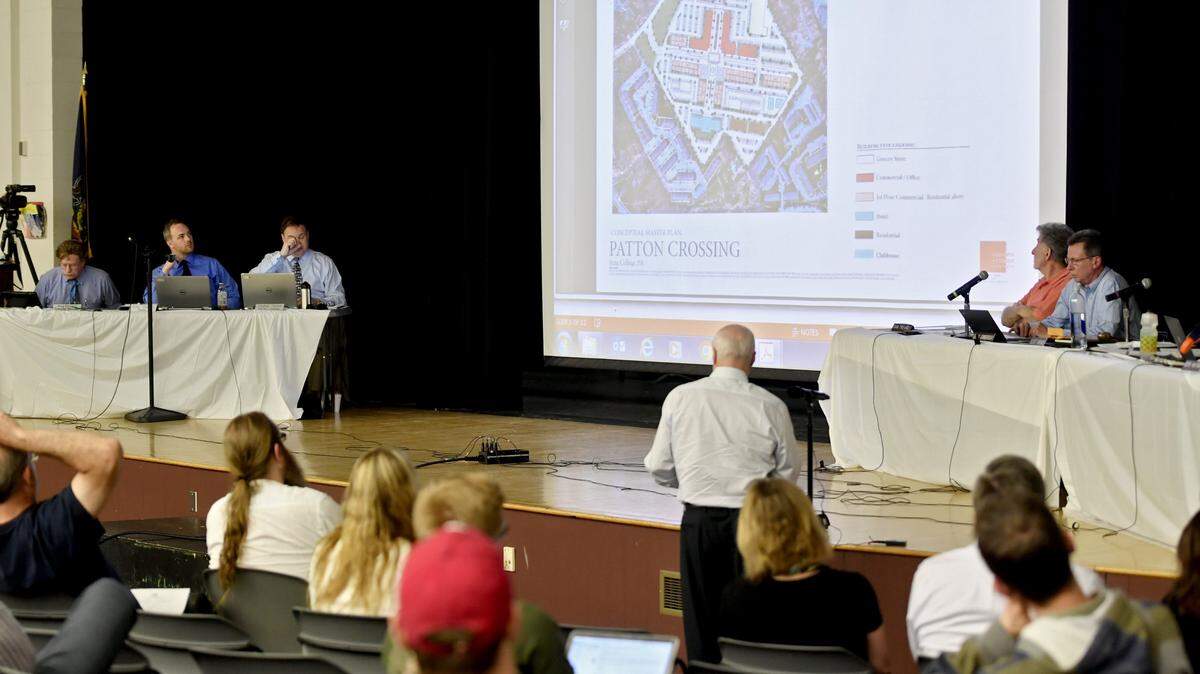 Bob Poole of 1752 North Atherton Street Associates speaks about the plans for Patton Crossing during a public hearing for the rezoning on May 9 at the Park Forest Middle School Auditorium.