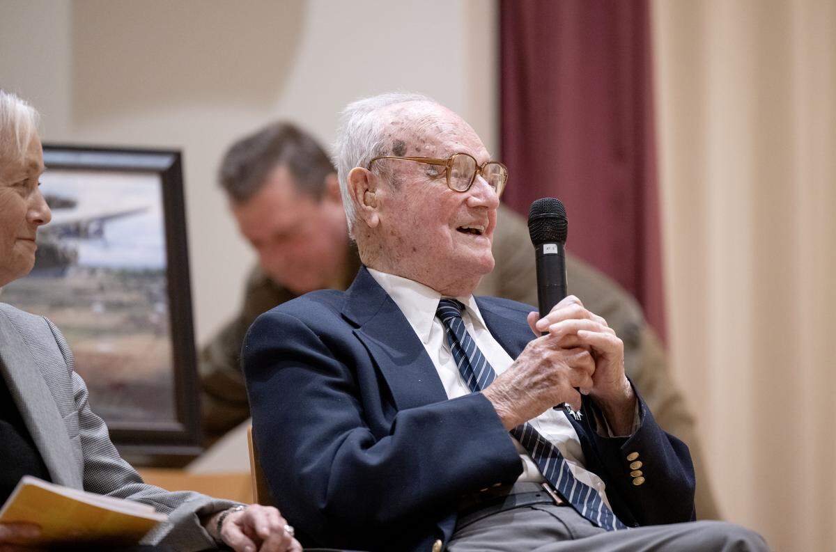 John F. Homan, a 101-year-old World War II veteran, speaks after being presented the French Legion of Honor during a ceremony at Foxdale Village on Wednesday, Dec. 10, 2025. 