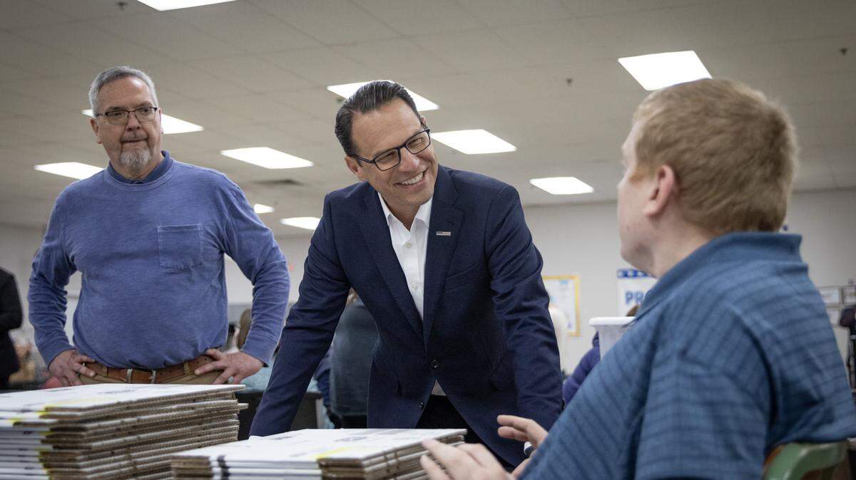 Gov. Josh Shapiro speaks with somene at a BARC Developmental Services event centering on his proposed investments in the 2024-25 budget to support Pennsylvanians with intellectual disabilities and autism.