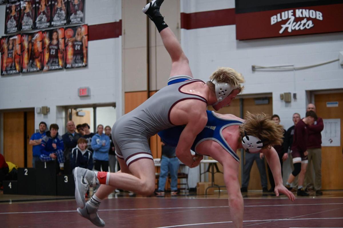 State College’s Pierson Manville returns Central Mountain’s Dalton Perry to the mat in their 139-pound finals match of the PIAA Class 3A Northwest Regional Championships on Saturday, Feb. 25, 2023 in Altoona. Manville topped Perry, 3-0.