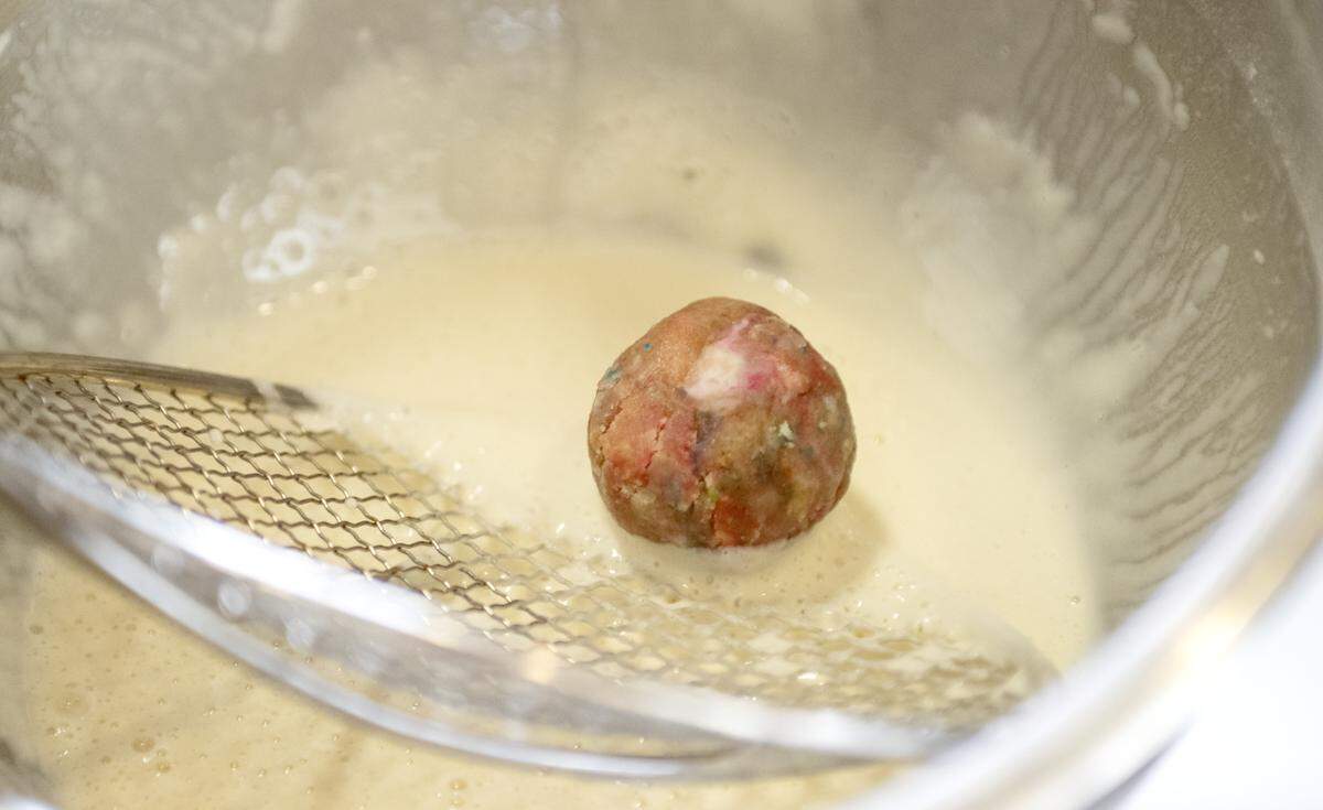 A funfetti cake bomb is made at The Parlor in Bellefonte on Thursday, Aug. 14, 2025. Cake bombs are deep fried cake balls with a ganache center and can be made into a sundae. 