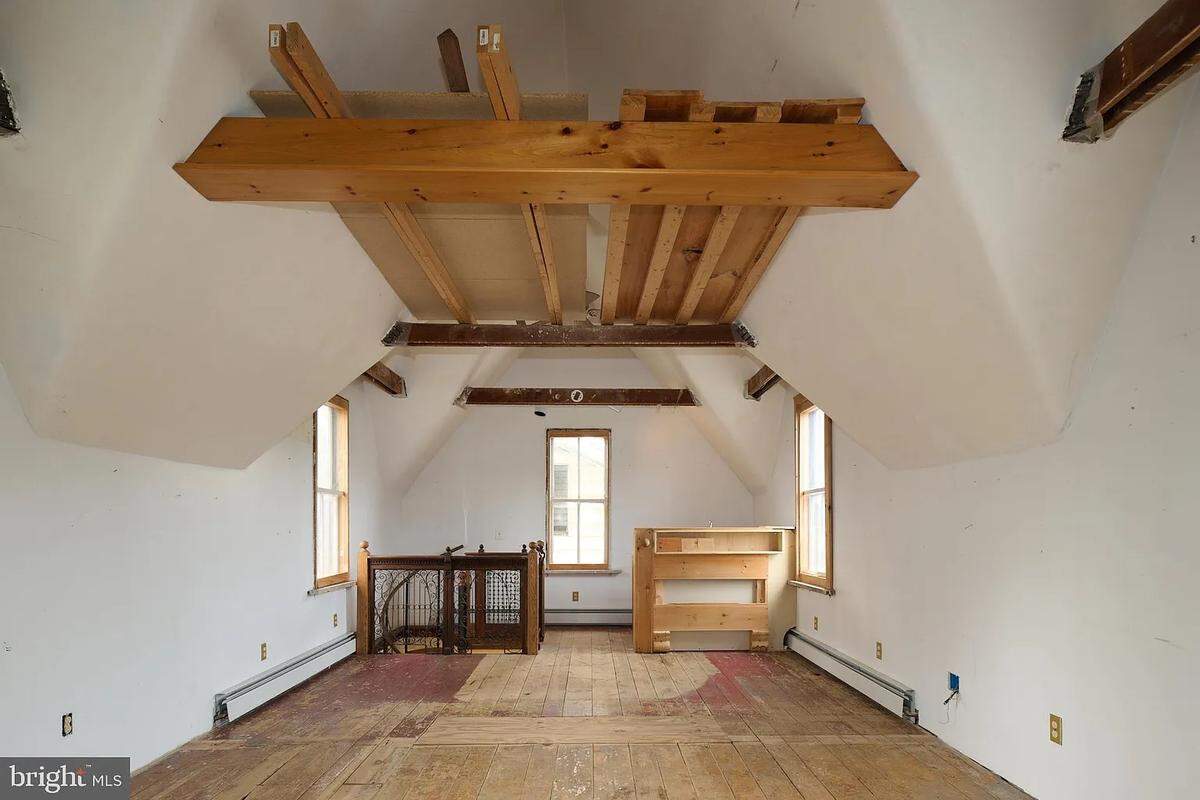 A look inside an upstairs room leading to the spiral staircase in the back left corner. Photo shared with permission from the home’s listing agent, Vicki Wedler of Kissinger, Bigatel and Brower Realtors.