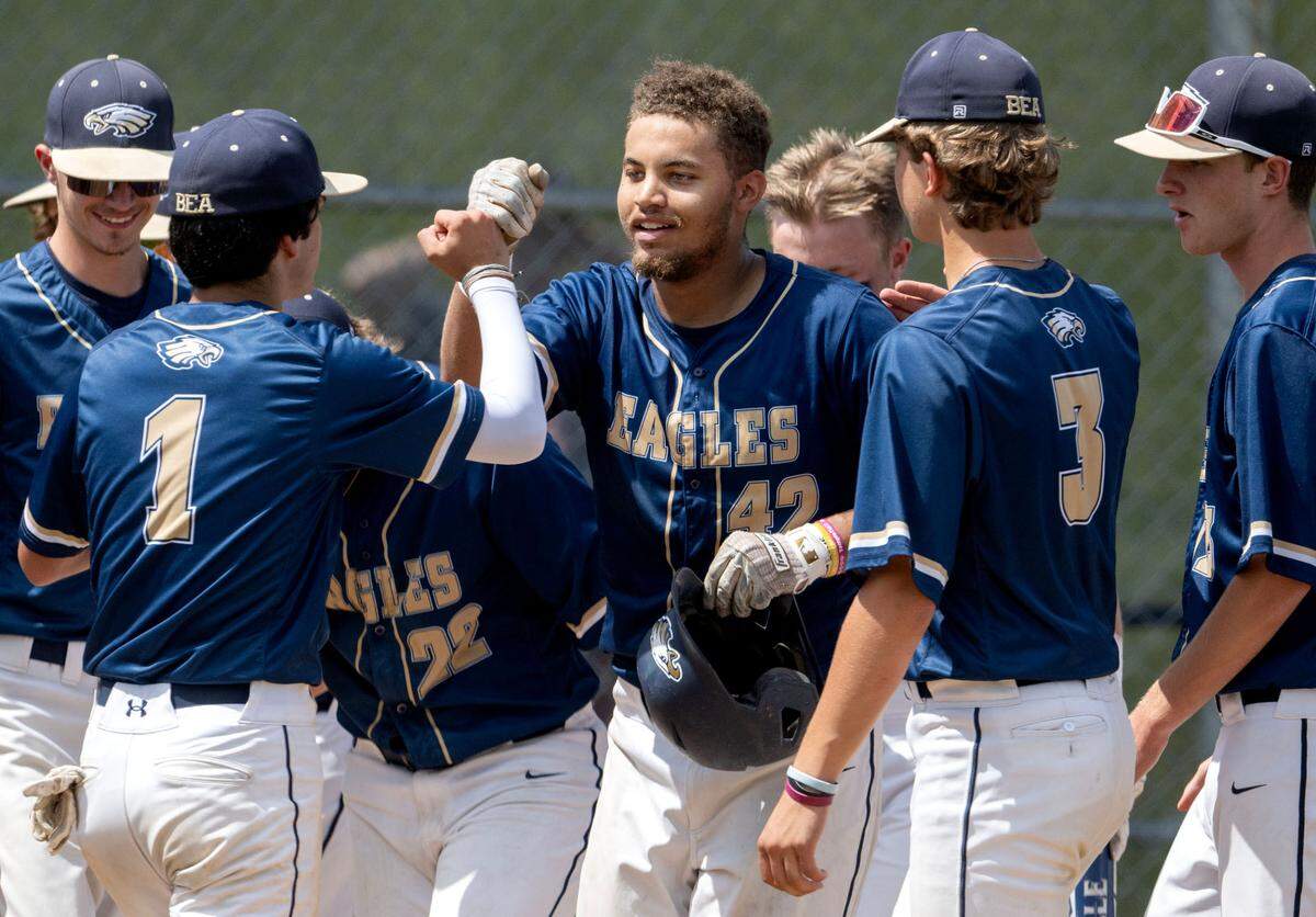 Bald Eagle Area’s Cam Watkins is congratulated by his teammates after his home run in the third inning of the PIAA first round game against Lakeview on Monday, June 3, 2024.