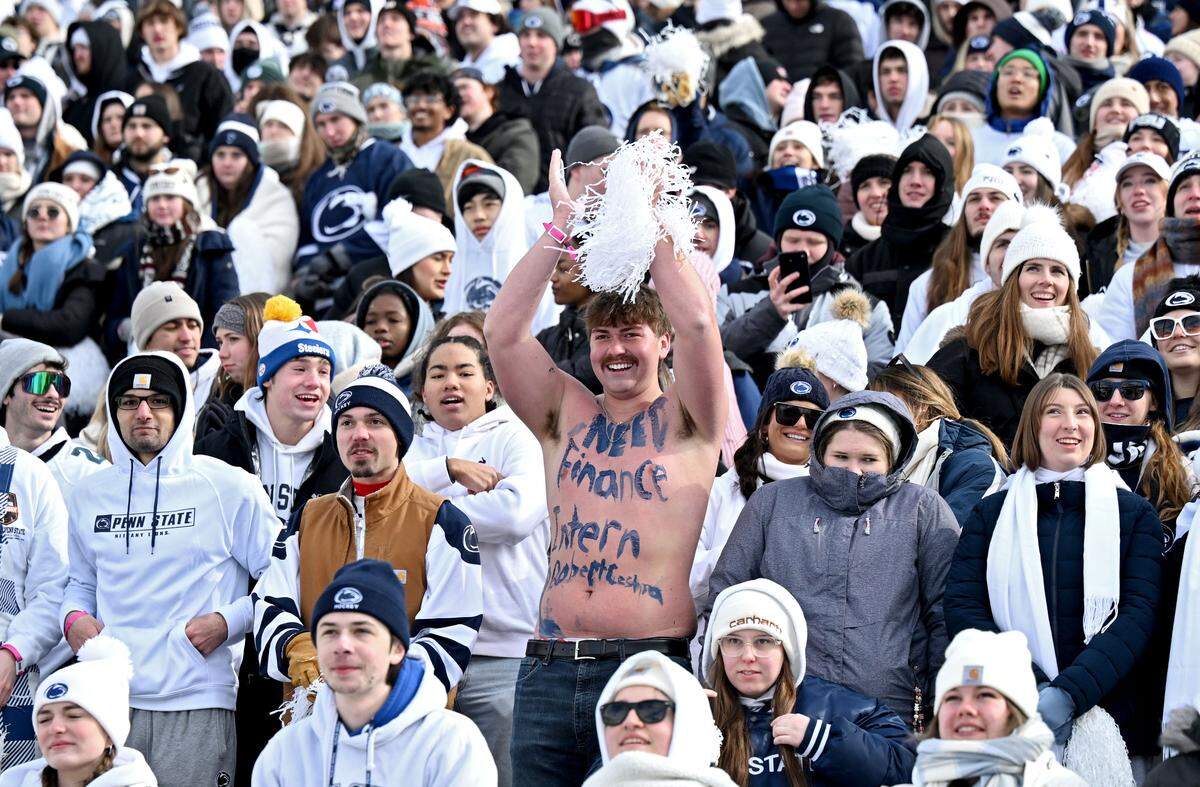 A shirtless fan cheers during the Penn State menÕs hockey game against Michigan State at Beaver Stadium on Saturday, Jan. 31, 2026.