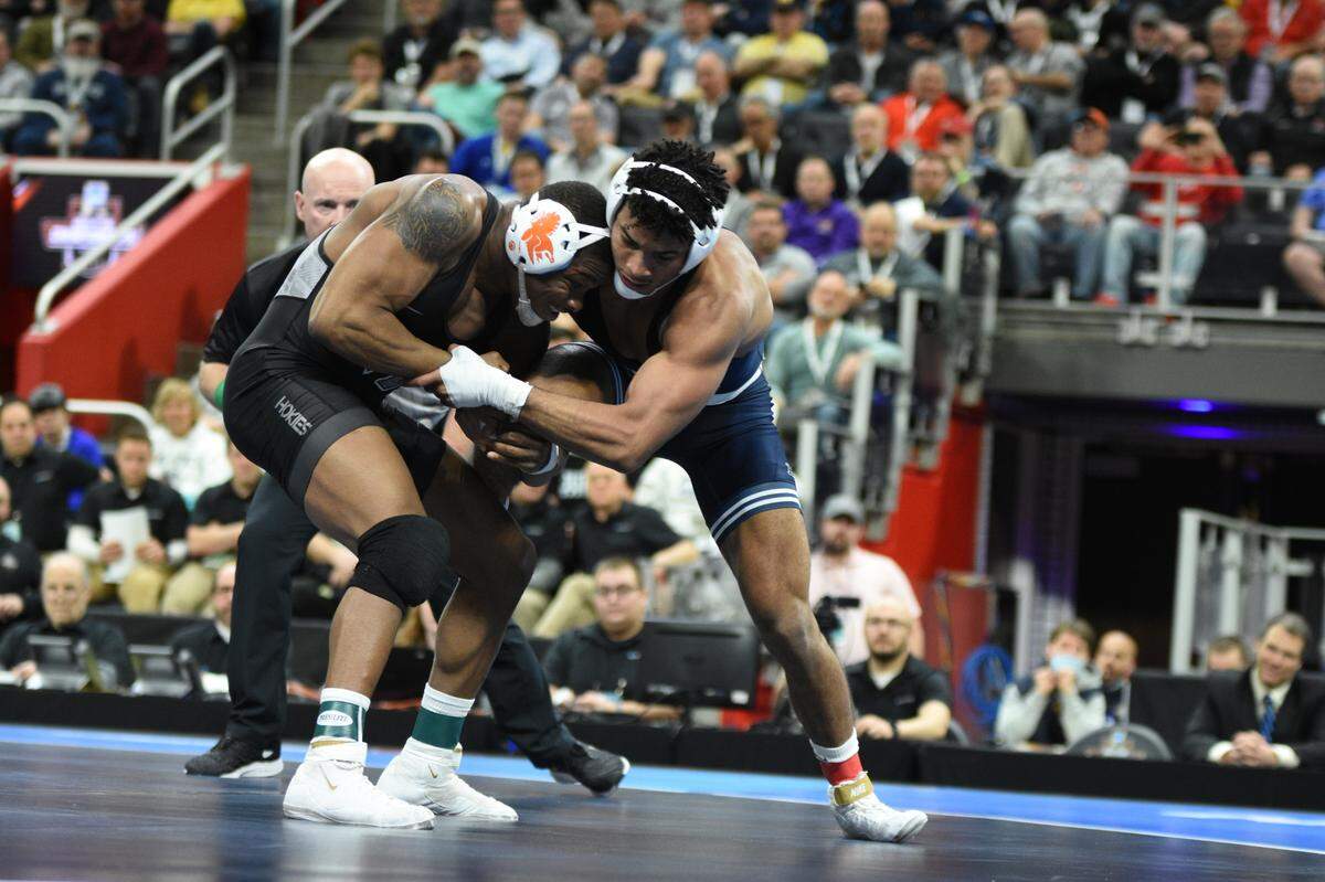 Penn State’s Carter Starocci fights off a takedown attempt from Virginia Tech’s Mekhi Lewis in their 174-pound finals match of the NCAA Championships on Saturday, March 19, 2022 at Little Caesars Arena in Detroit. Starocci topped Lewis, 6-5, in ultimate tie breaker No. 2 to repeat as a champion.