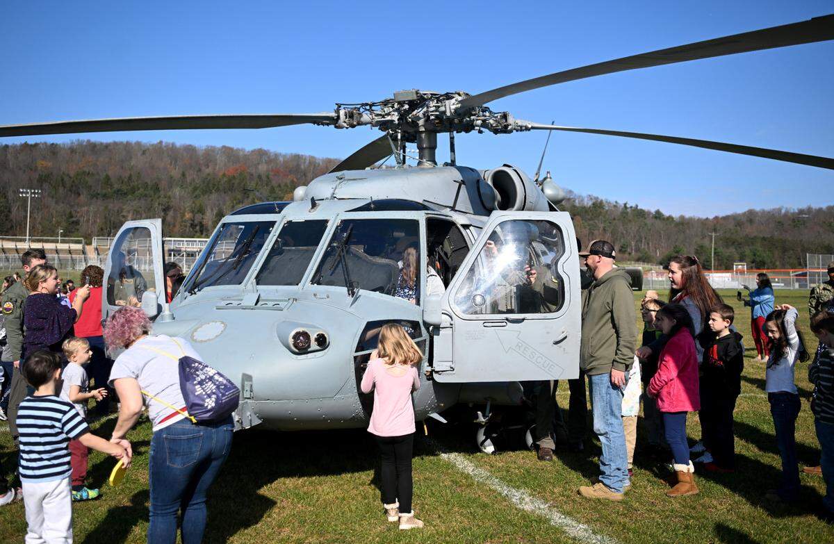 Bald Eagle Area elementary students get to explore the VX-1 Pioneers MH-60S helicopters that were flown in for the Veterans Day celebration on Thursday, Nov. 9, 2023.
