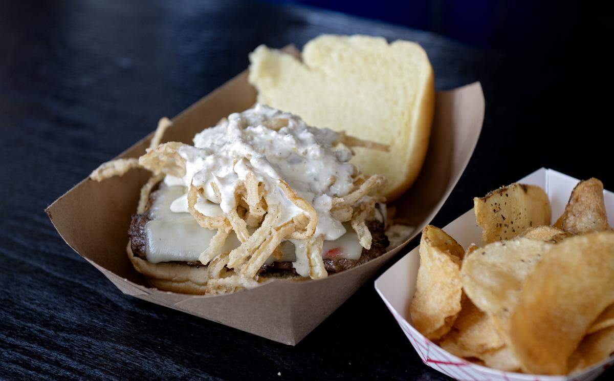 A Haystack Jalapeño Burger and homemade chips from Twin B Farms at the Centre County Grange Fair on Friday, Aug. 15, 2025.  The Haystack Jalapeño Burger features pepper jack cheese, locally grown onion straws and a homemade jalapeno mayo.  