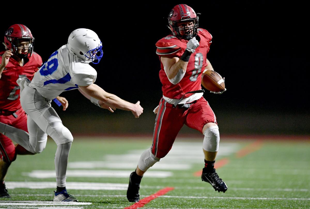 Central Mountain defenders can’t stop Bellefonte’s C.J. Funk as he runs down the field for a first down during the game on Friday, Sept. 13, 2019.