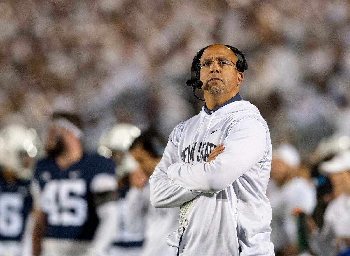 Penn State football coach James Franklin watches a replay during the game against Minnesota on Saturday, Oct. 22, 2022.