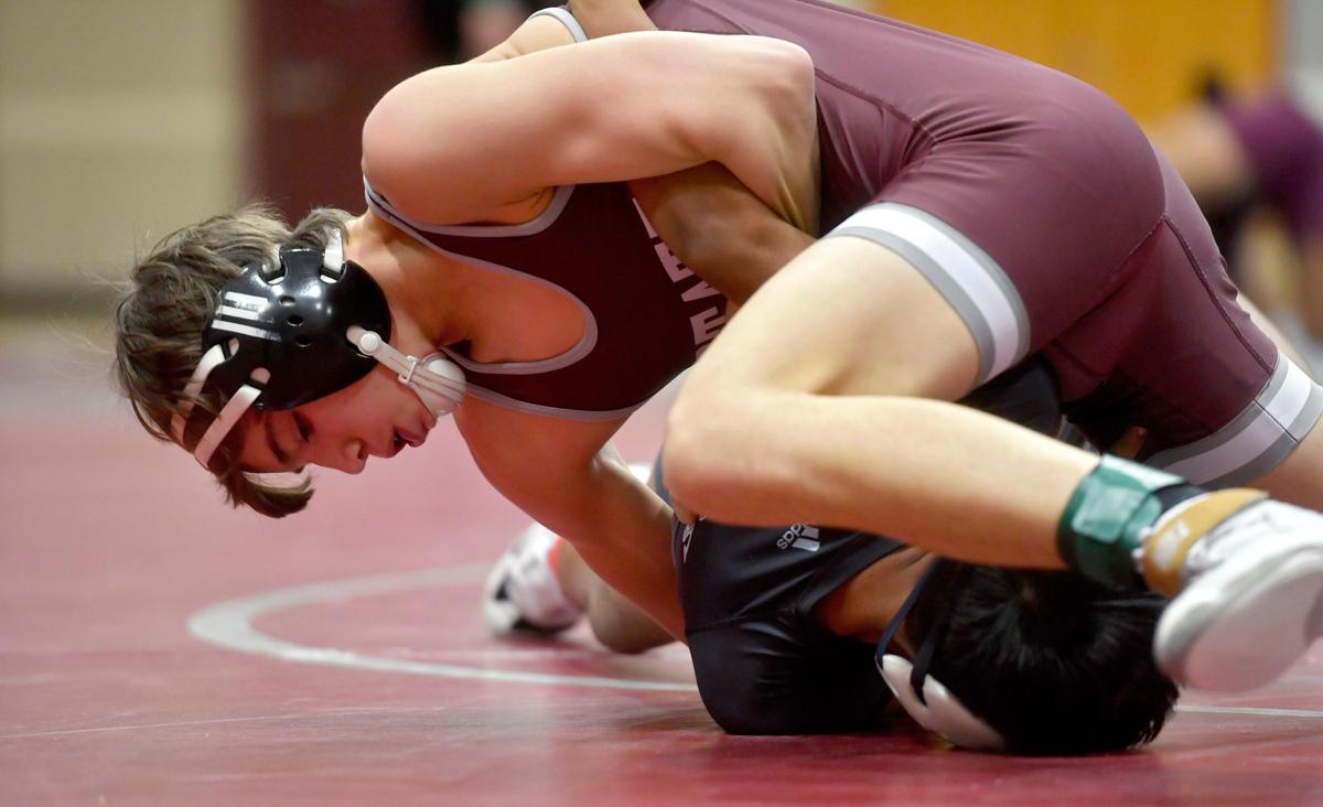 State College’s Carter Weaverling controls Harrisburg’s Eladio Perez in the 126 lb bout during the match on Tuesday, Dec. 17, 2019. Weaverling won by fall in 1:05.