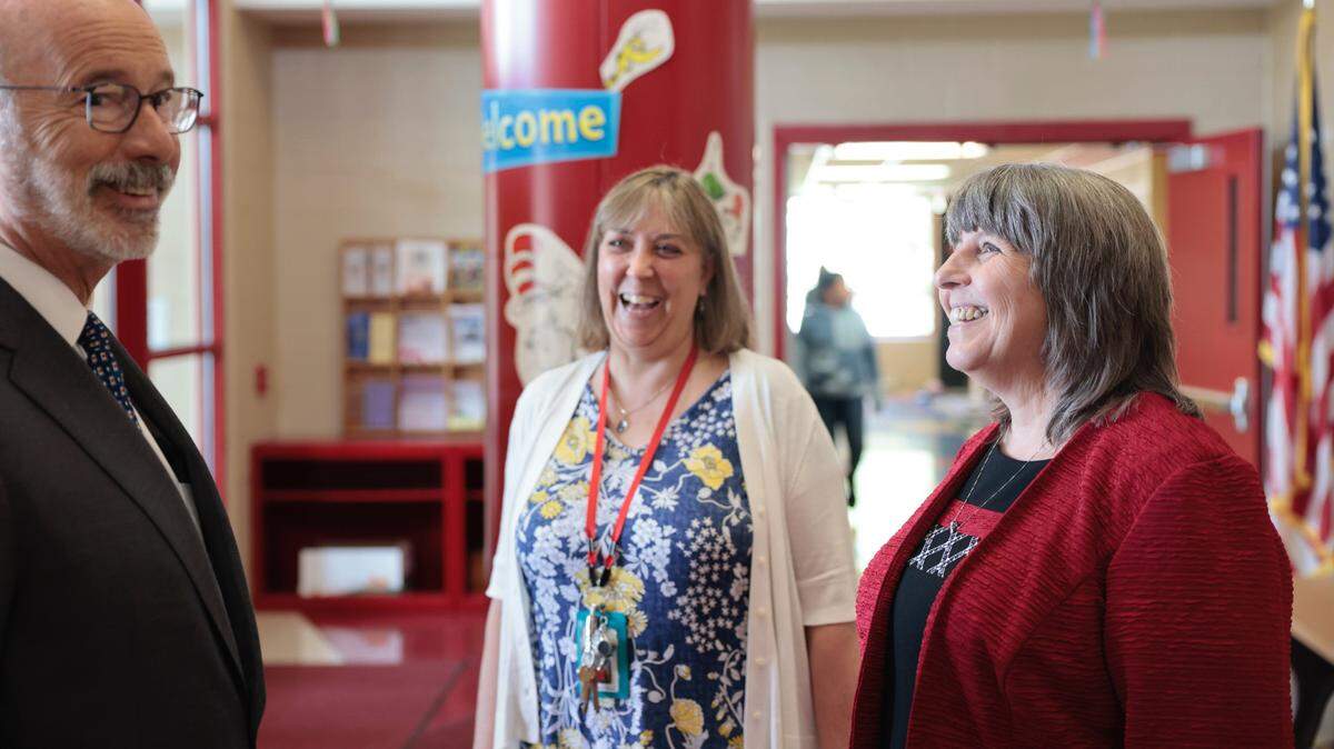 Former Pennsylvania Gov. Tom Wolf talks with Bellefonte Area School District superintendent Tammie Burnaford, right, during a visit to Marion-Walker Elementary School on Wednesday, May 18, 2022.