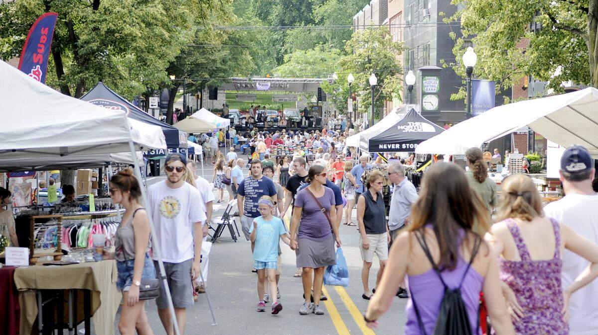 Visitors walk through the street sales on Allen Street during the 2013 Summer's Best Music Fest. Centre Foundation hopes to test a pedestrian-only concept for the street this summer.
