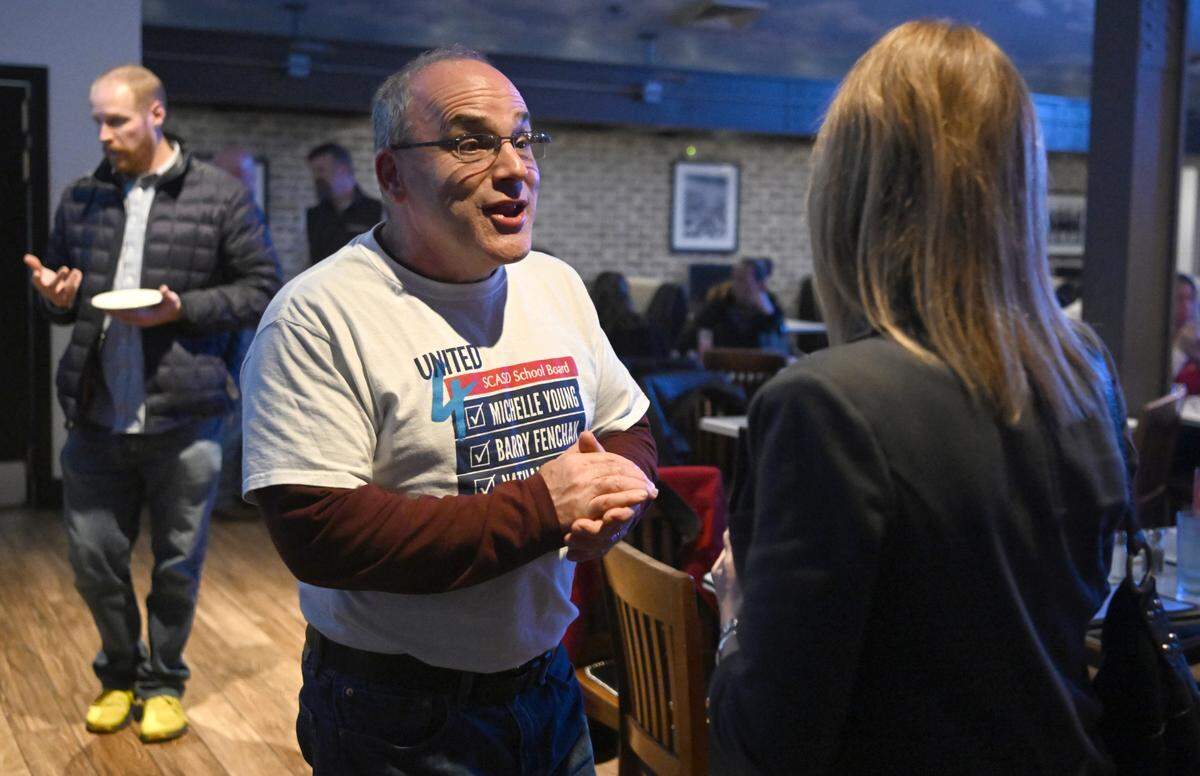 State College school board candidate Barry Fenchak talks with supporters during an Election Night party on Tuesday, Nov. 7, 2023 at Champs.