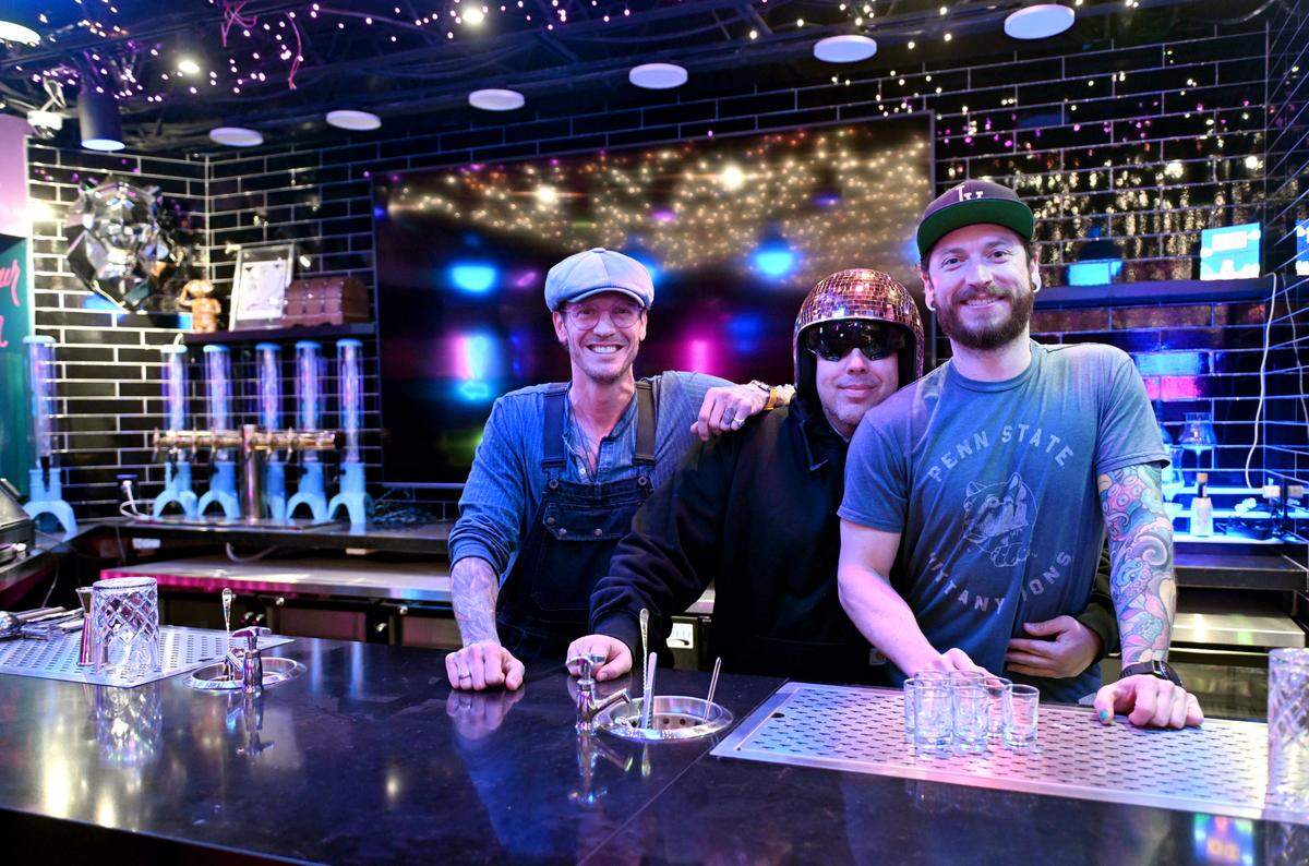 Michael Fullington, Daniel Cutshull and Bryan Pierzga pose at The Hideaway in downtown State College on Monday, Feb. 10, 2025.