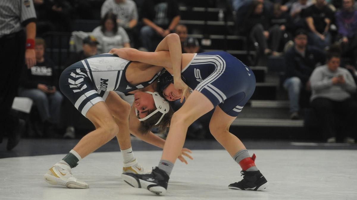 Philipsburg-Osceola’s Caleb Hummel, left, was one of seven wrestlers to have a perfect week as he amassed four wins.