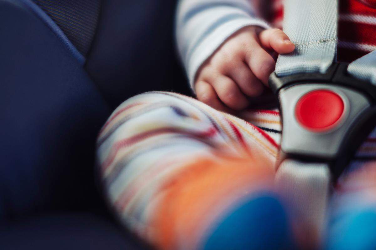 A baby in a car seat.