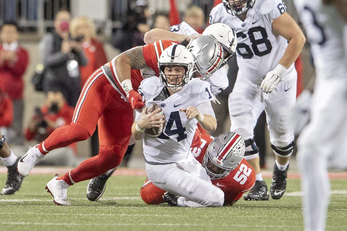 Ohio State defenders sack Penn State quarterback Sean Clifford during the game on Saturday, Oct. 30, 2021 at Ohio Stadium.