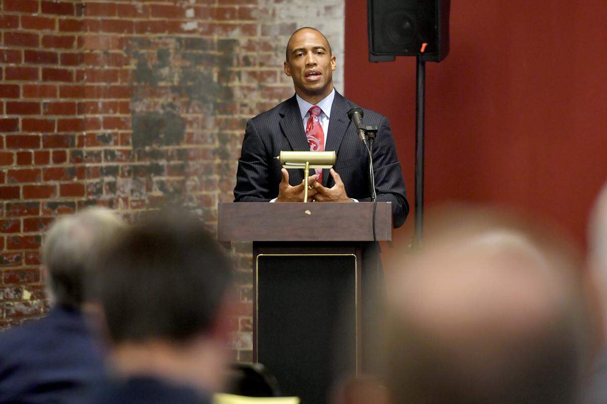 Scott Turner, Executive Director of the White House Opportunity and Revitalization Council, addresses the crowd about the Bellefonte Opportunity Zone on Monday at the Match Factory in Bellefonte.