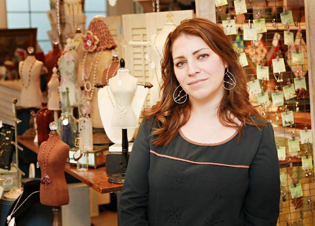 Staci Egan, co-owner of Philipsburg art shop Smith and Front, in front of her store’s display. Egan and her husband closed the store after Gov. Tom Wolf announced the closure of all nonessential businesses in Pennsylvania.