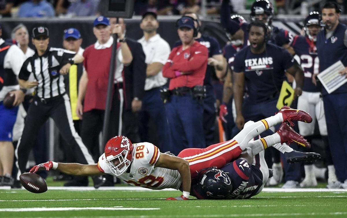 Kansas City Chiefs tight end Ross Travis reached and recovered a loose ball over Houston Texans inside linebacker Zach Cunningham on October 8, 2017 at NRG Stadium in Houston, Texas.