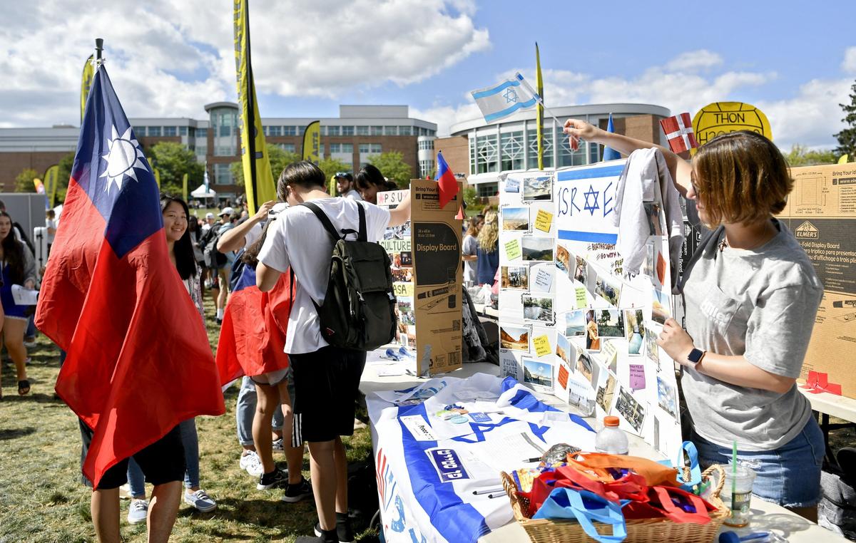 Penn State international clubs promote their organizations at the club fair on Thursday, August 29, 2019 on the HUB lawn.