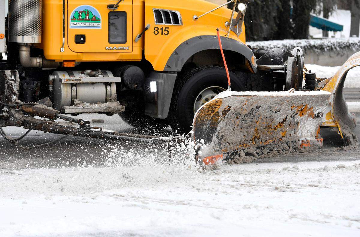 A State College Borough snow plow clears South Atherton Street on Thursday, Feb. 18, 2021.