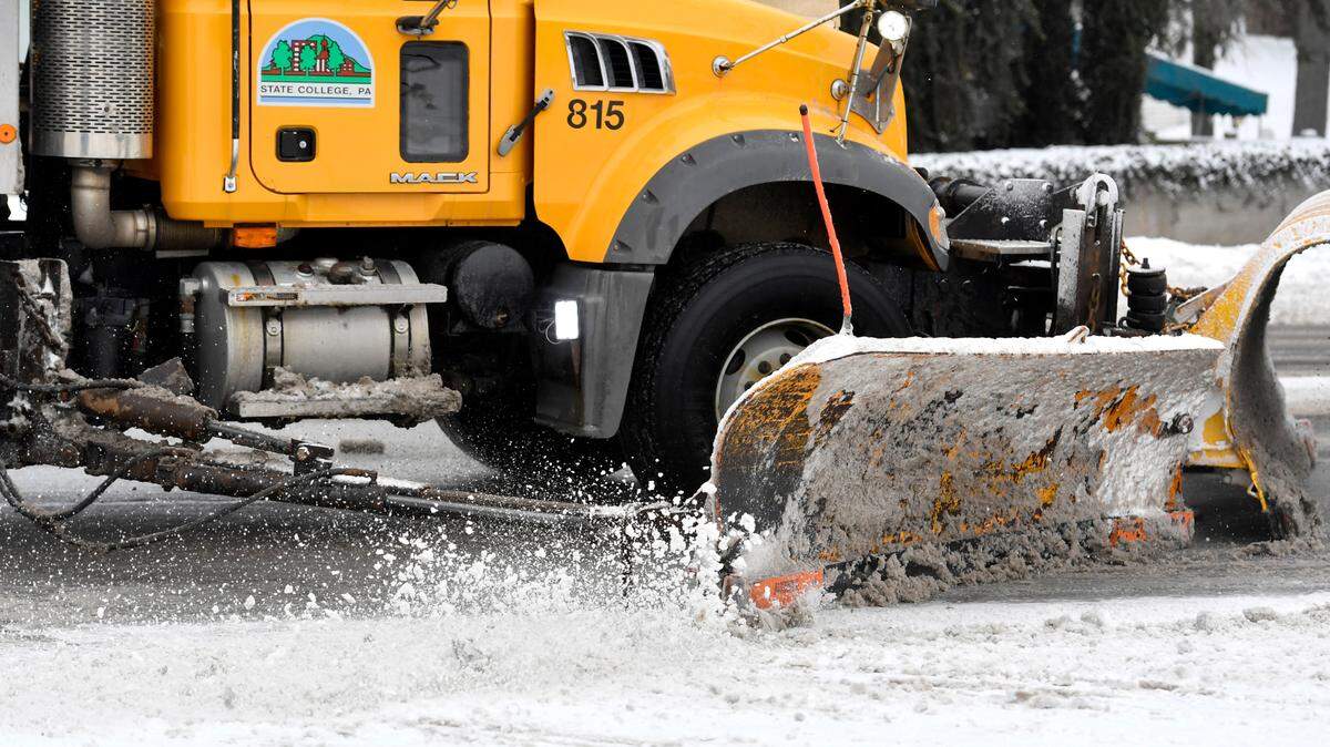 A State College Borough snow plow clears South Atherton Street on Thursday, Feb. 18, 2021.