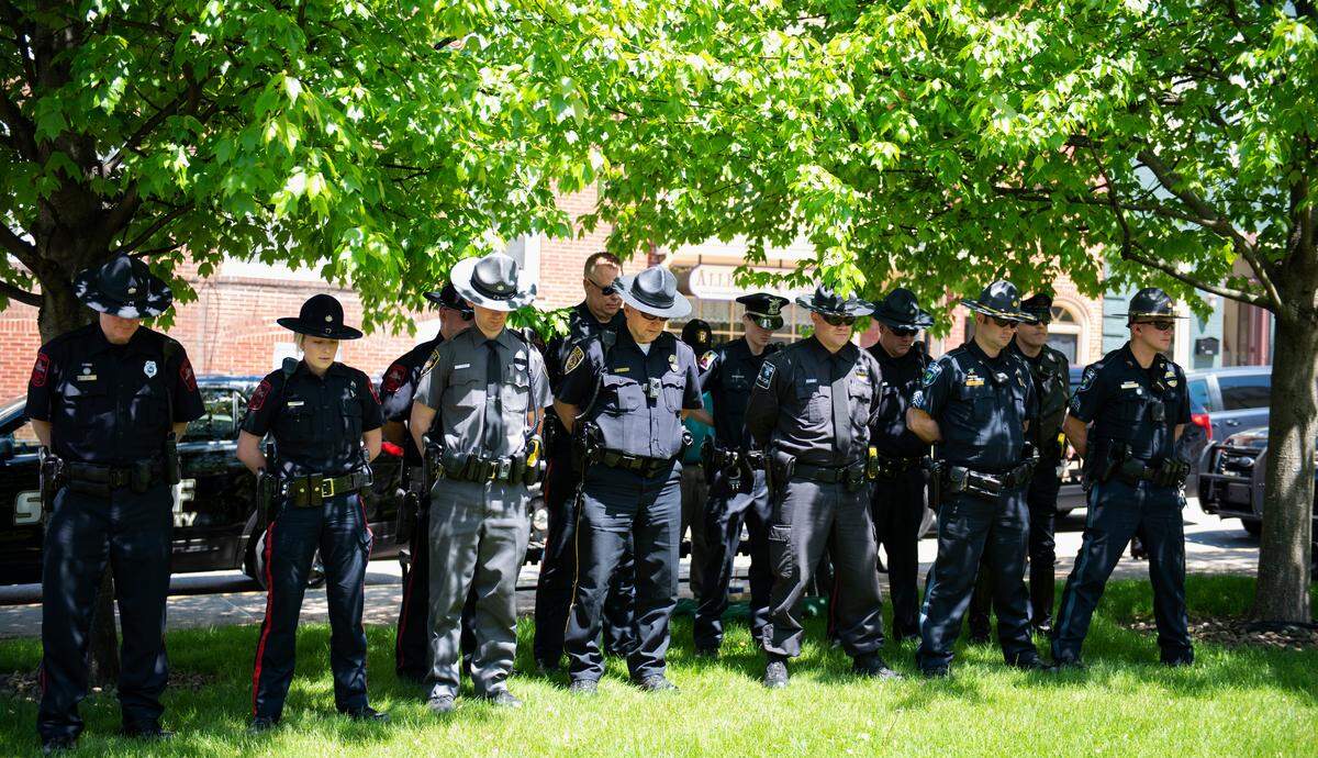 Police officers listen to the speaker at the annual Centre County Law Enforcement Memorial ceremony at the Centre County Courthouse in Bellefonte in May 2019.