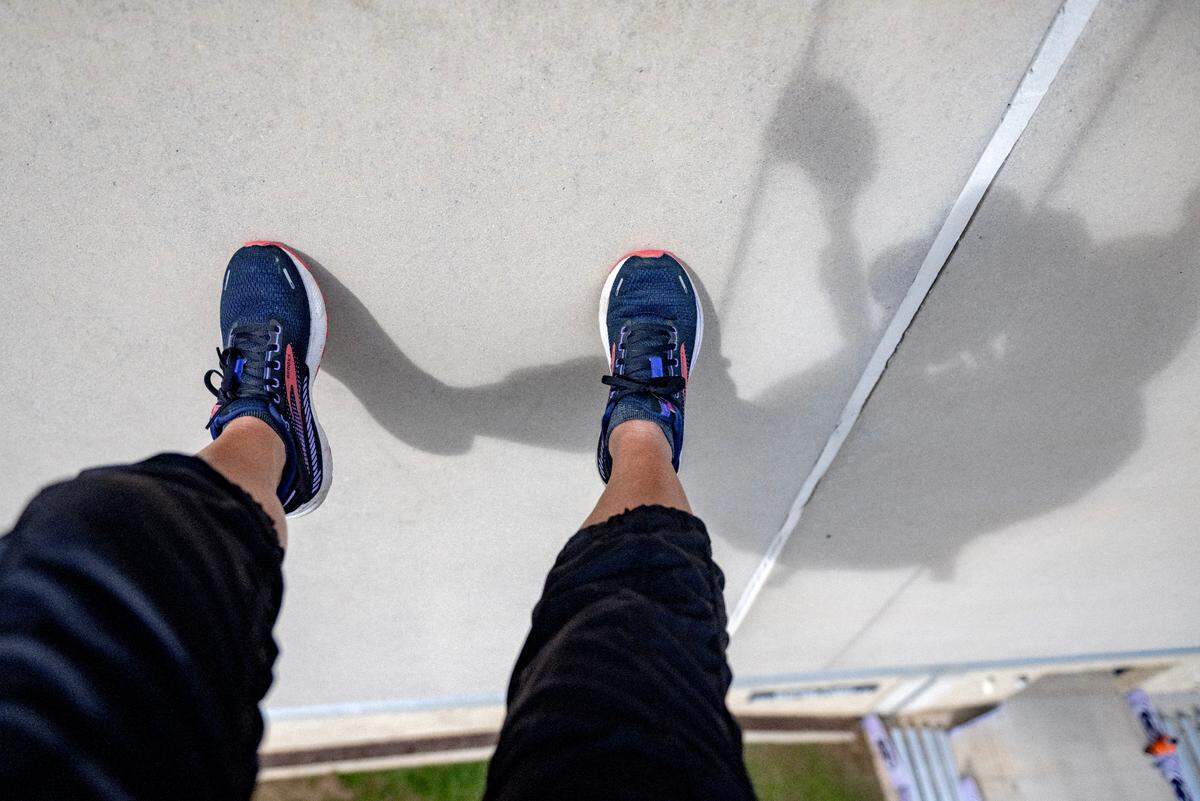 Abby Drey’s shadow at the start of the descent down Beaver Stadium. Only the first few feet have a wall that you can use your feet to guide you.