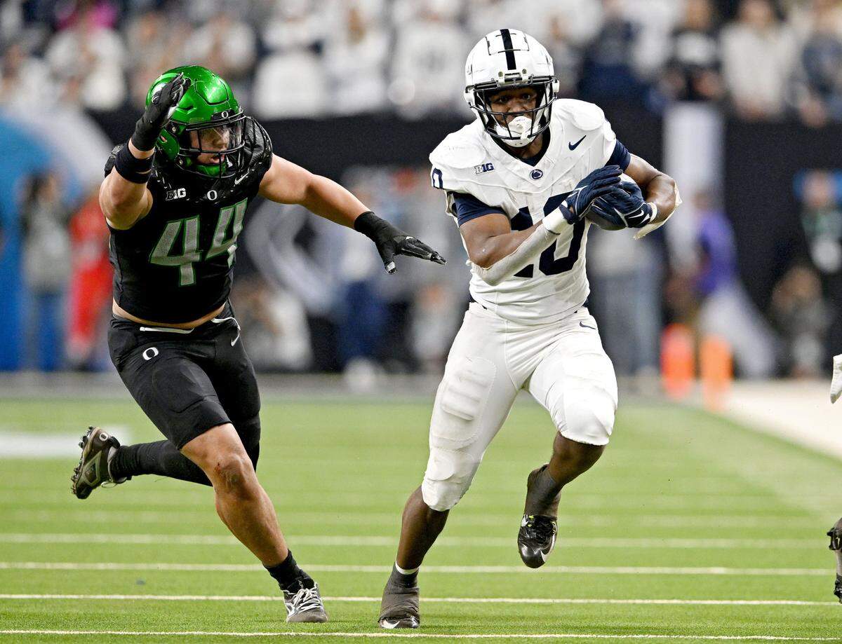 Penn State running back Nick Singleton runs downfield against Oregon in the first half of the Big Ten Championship game at Lucas Oil Stadium on Saturday, Dec. 7, 2024.