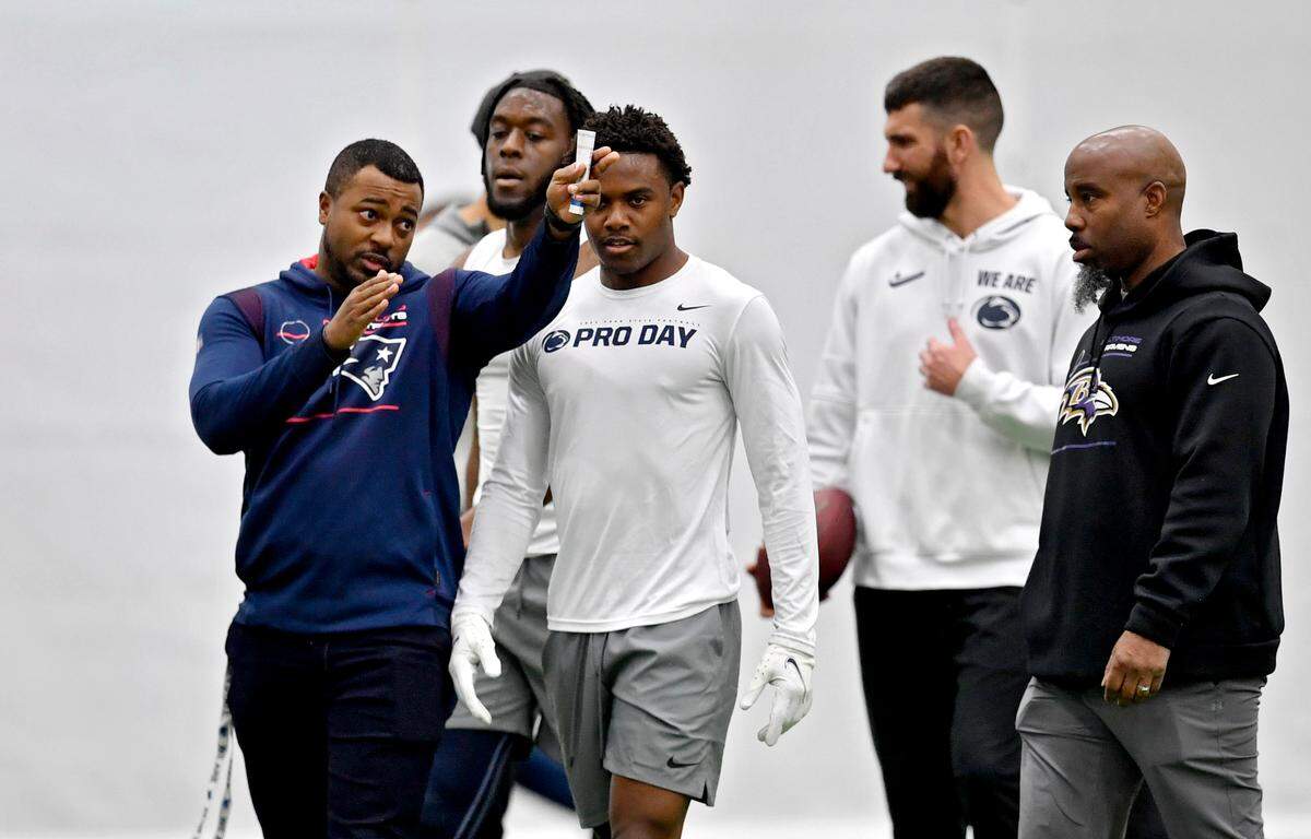 An NFL scout explains the route they want wide receiver Jahan Dotson to run during Penn State pro day on Thursday, March 24, 2022.