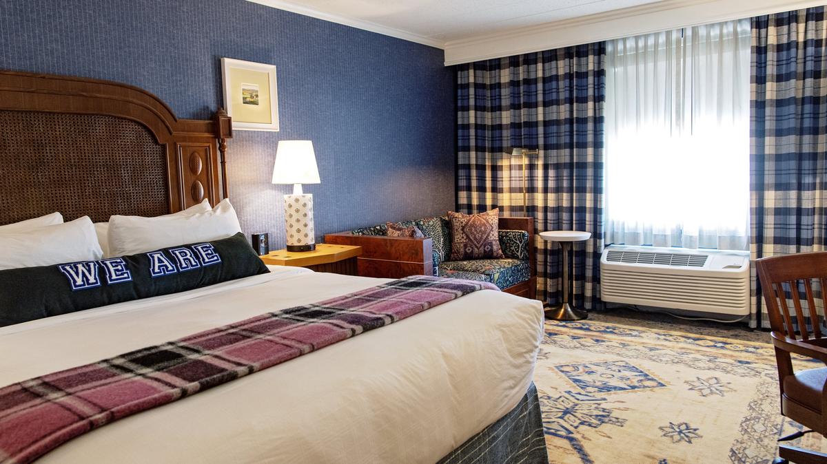 A king suite room is pictured at the Graduate State College in 2019. Hilton announced Thursday that it was acquiring the Graduate Hotels brand.
