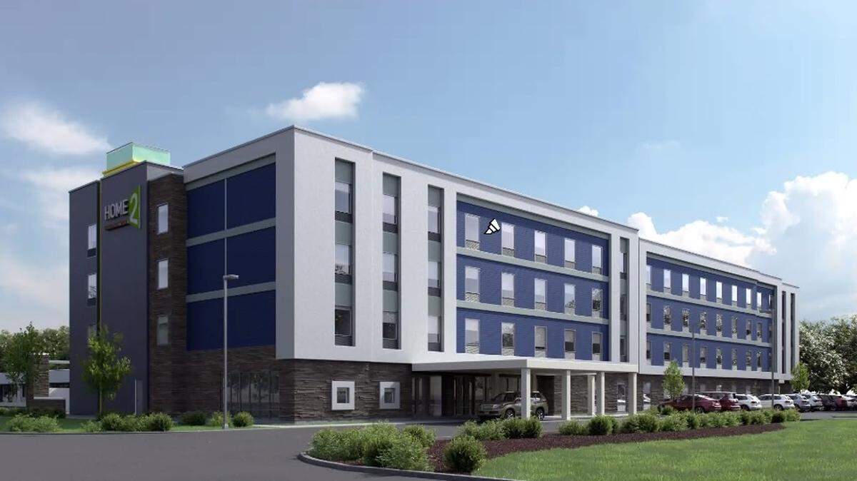 A rendering of the proposed hotel at 1401 S. Atherton St., at and around the site of the Autoport. The hotel is planned to be four stories, with a developer using a loophole triggered by affordable housing.
