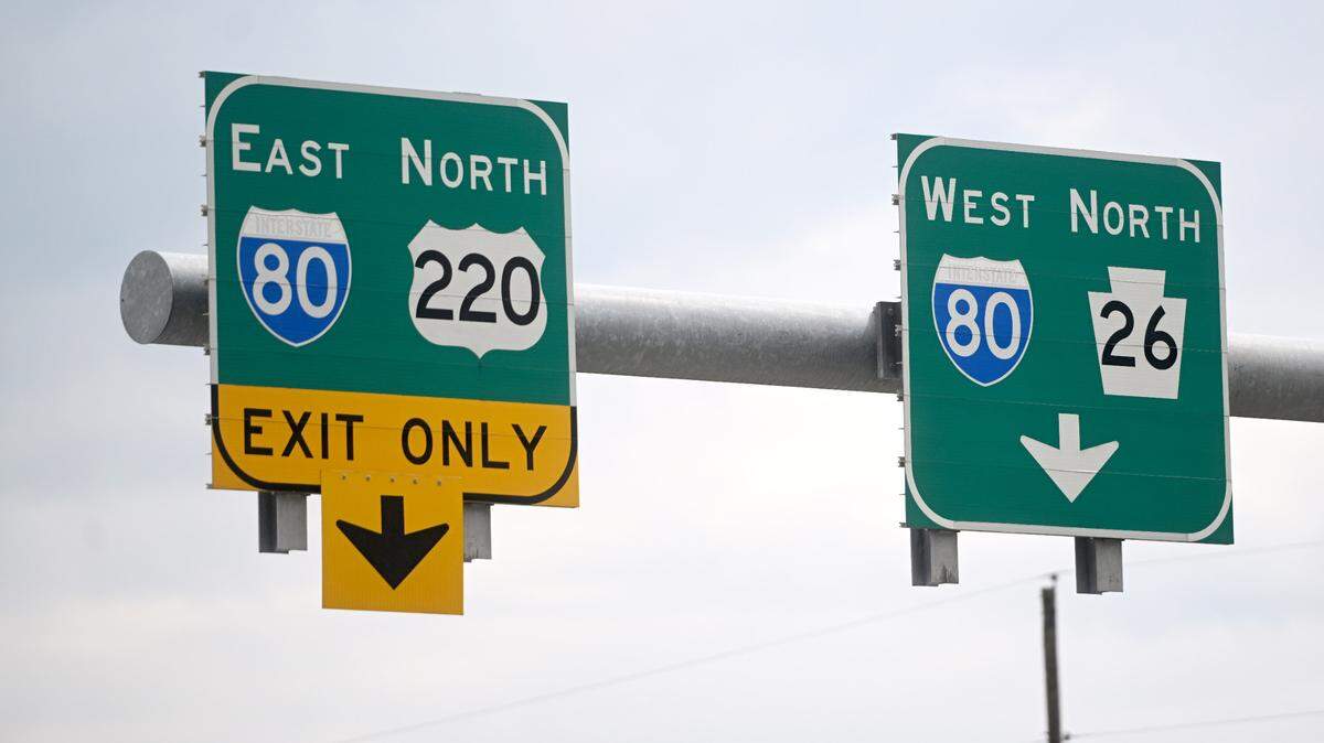 Signs for which lane to be in to get on I-80 at the Bellefonte interchange on Thursday, April 18, 2024. 