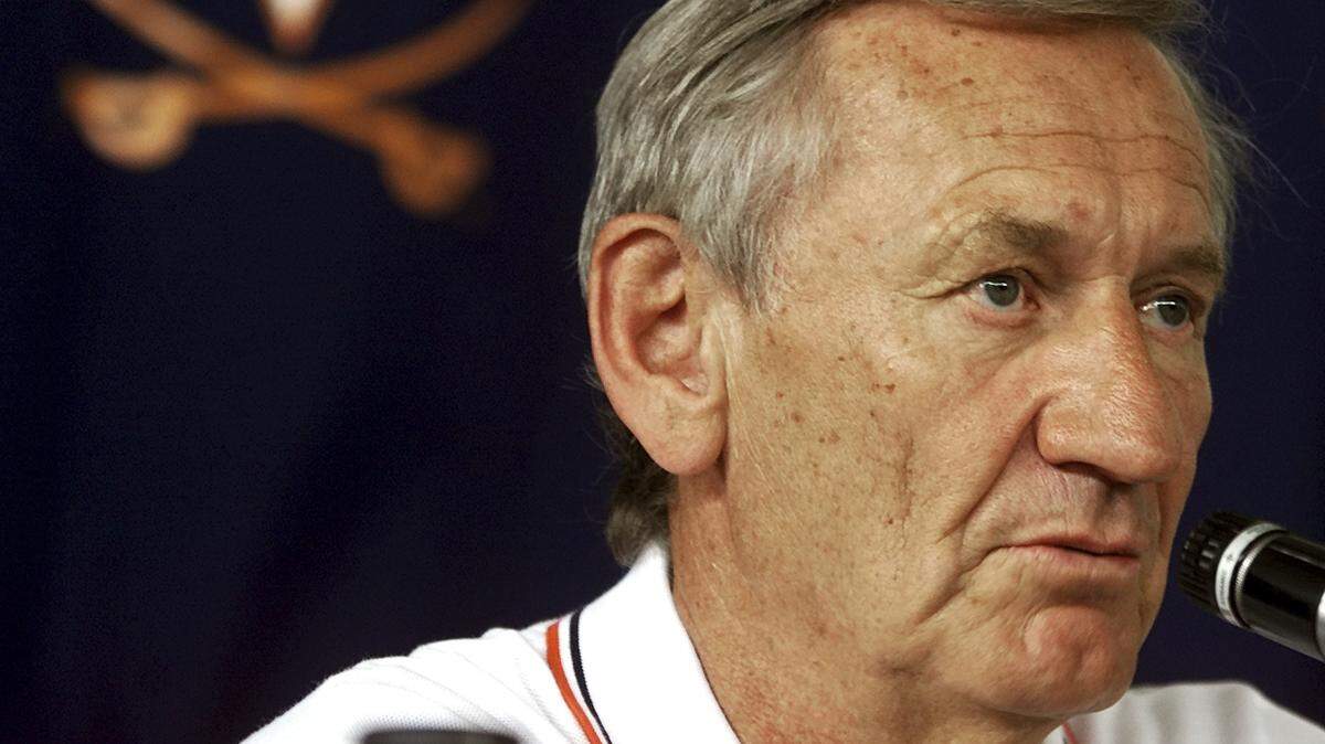 FILE - In this Aug. 11, 2000, file photo, then-Virginia NCAA college football coach George Welsh speaks at a news conference in Charlottesville, Va. Welsh, who coached football at Virginia for 19 years and retired as the Atlantic Coast Conference’s career victories leader, has died. The school made the announcement in a release Friday, Jan. 4, 2019, saying Welsh’s family says he died peacefully in Charlottesville on Wednesday. He was 85.