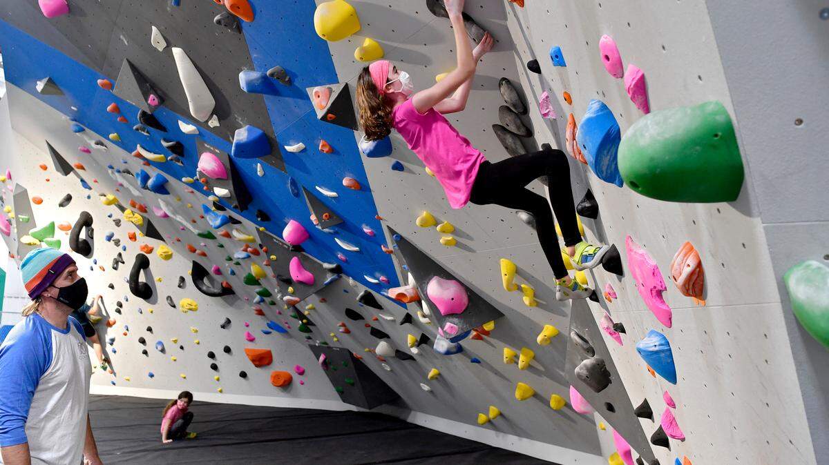 Rich Bundro watches his daughter Samantha as she climbs at Climb Nittany on Thursday, Nov. 12, 2020. The gym in Boalsburg is set to close at the end of May.