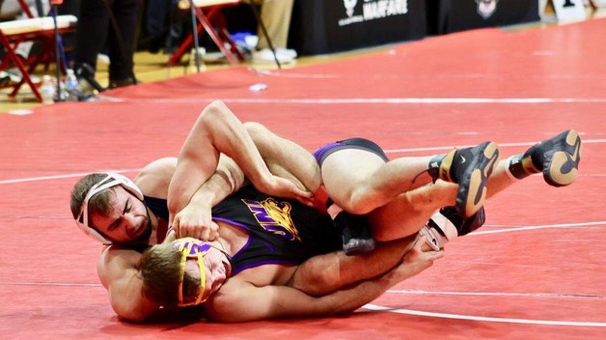 Penn State’s No. 3 Max Dean turns Northern Iowa’s Noah Glaser on Monday, Dec. 20. 2021, at the Collegiate Duals in Niceville, Florida. Dean won by technical fall, 19-3 in 5:21.