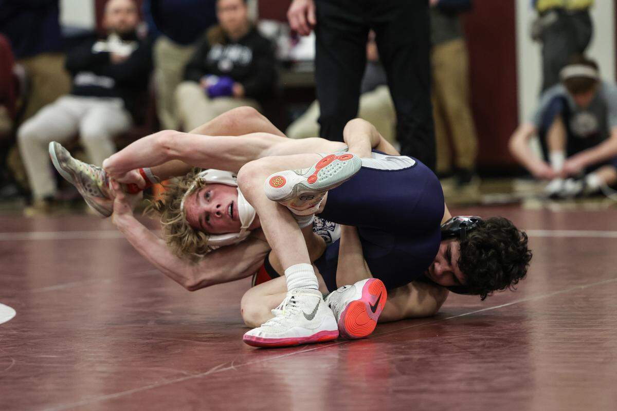 Penns Valley’s Max Dinges scrambles with Bishop McCort’s Keegan Bassett in their 121-pound championship match of the PIAA Class 2A Southwest Regional Championships on Saturday, Feb. 28, 2026 in Altoona. Bassett edged Dinges, 2-0.