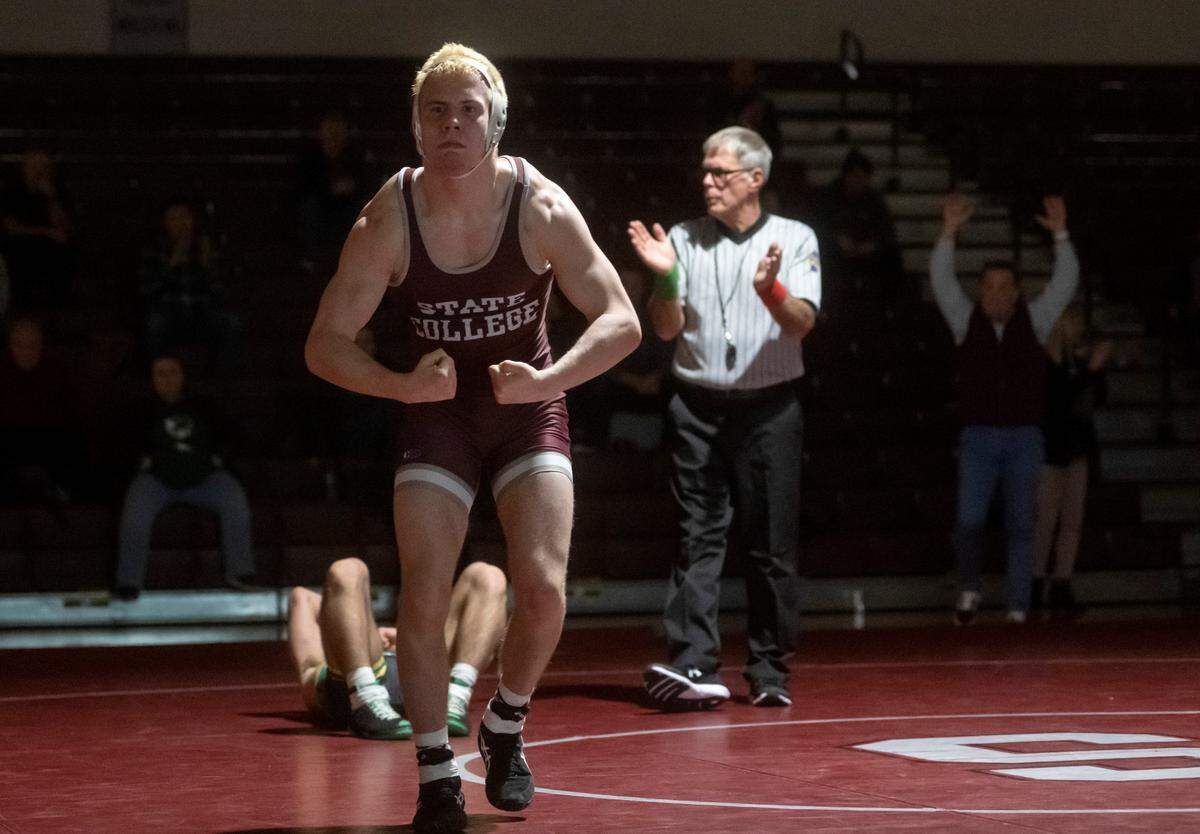 State College’s Pierson Manville celebrates his 1-0 win over Central Dauphin’s Matt Repos in the 145 lb bout of the match on Wednesday, Dec. 14, 2022.