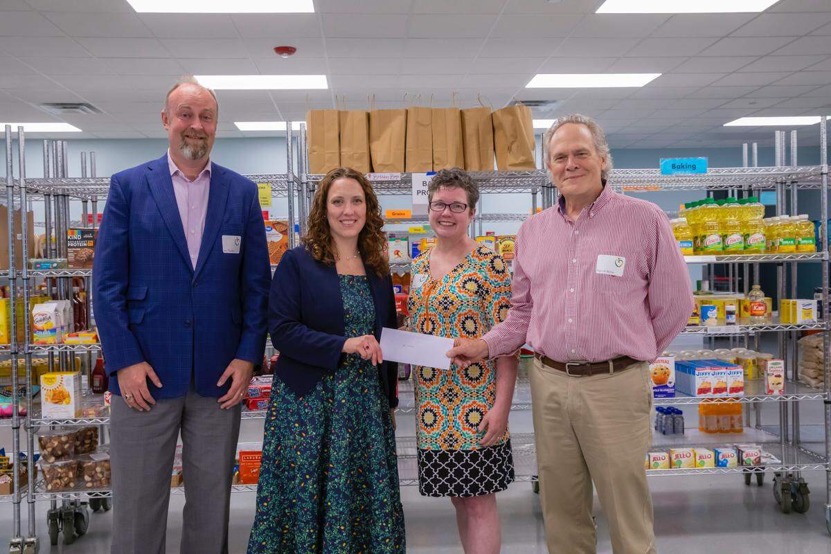 From left: Jens Thorsen, State College Food Bank Board President; Allayn Beck, State College Food Bank Executive Director; Jennifer Shuey, Hamer Foundation trustee; and Patrick Morse, Hamer Foundation trustee, celebrate the food bank reaching its goal for the capital campaign.