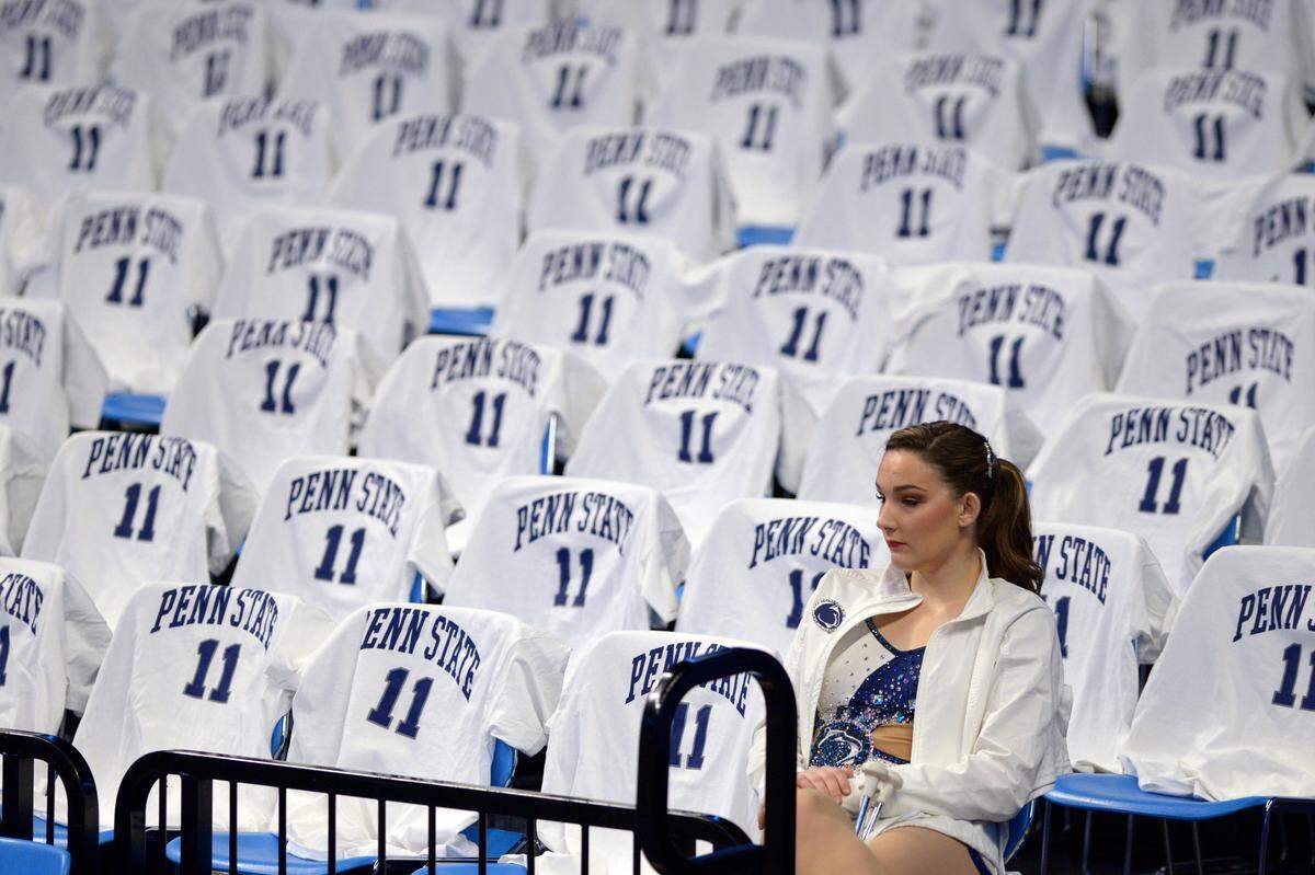 Gillian Brooks, a Penn State student from Farmington Hills, Michigan, sits among T-shirts recognizing Penn State’s Lamar Stevens, who was being recognized Saturday before Penn State’s basketball game against Minnesota for his work with special needs kids and recently becoming the school’s third all-time scorer at the Bryce Jordan Center.